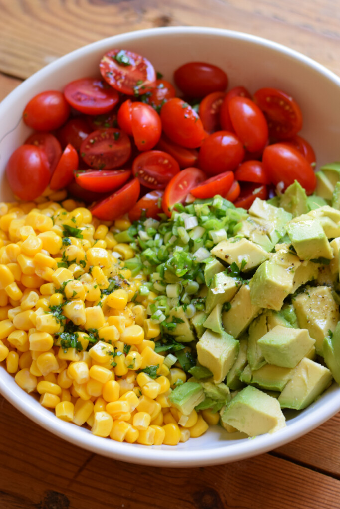 Adding dressing to a salad.
