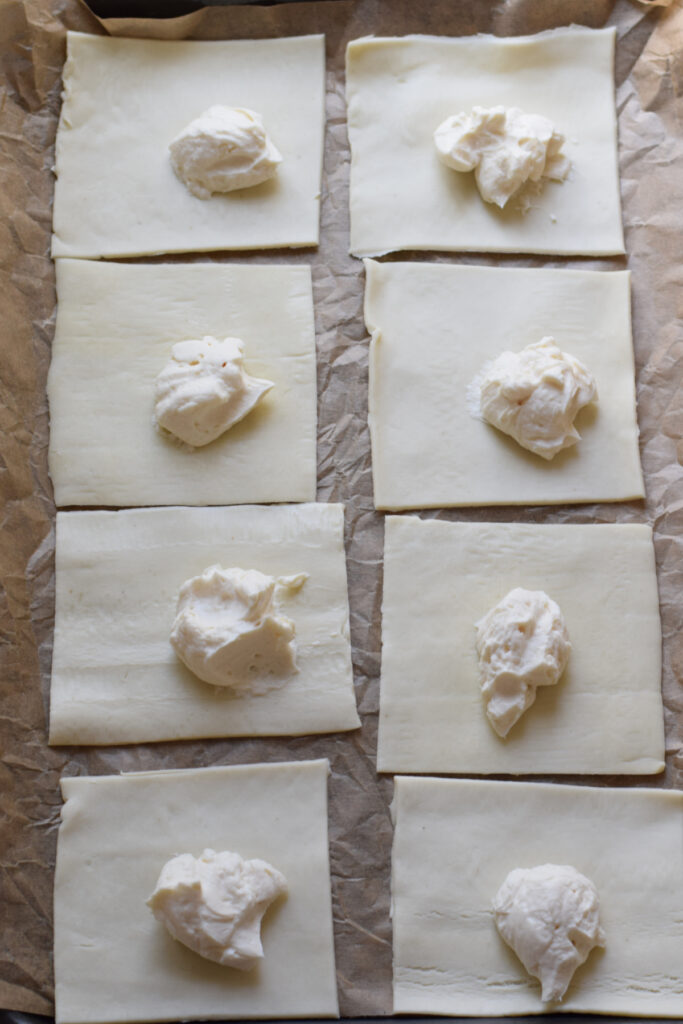 Cream cheese filling in the centre of pastry squares.
