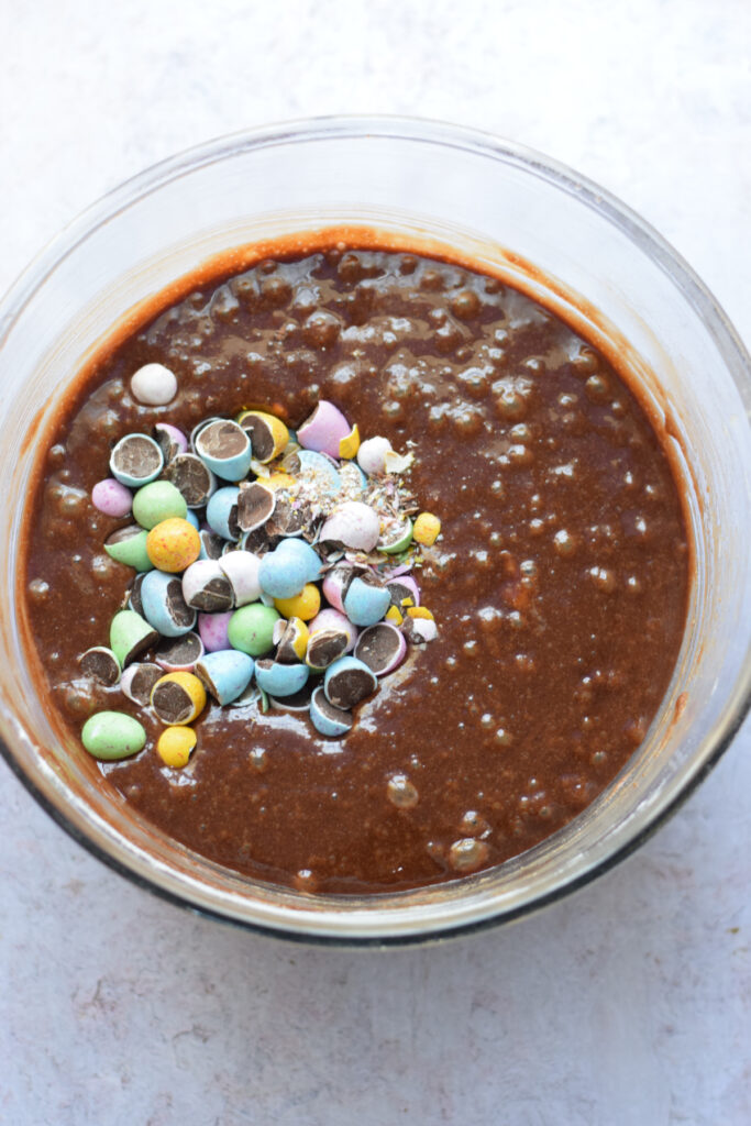 Adding Easter candy to brownie batter.