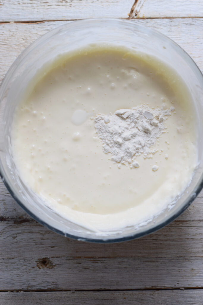 Making cream cheese mixture in a glass bowl.