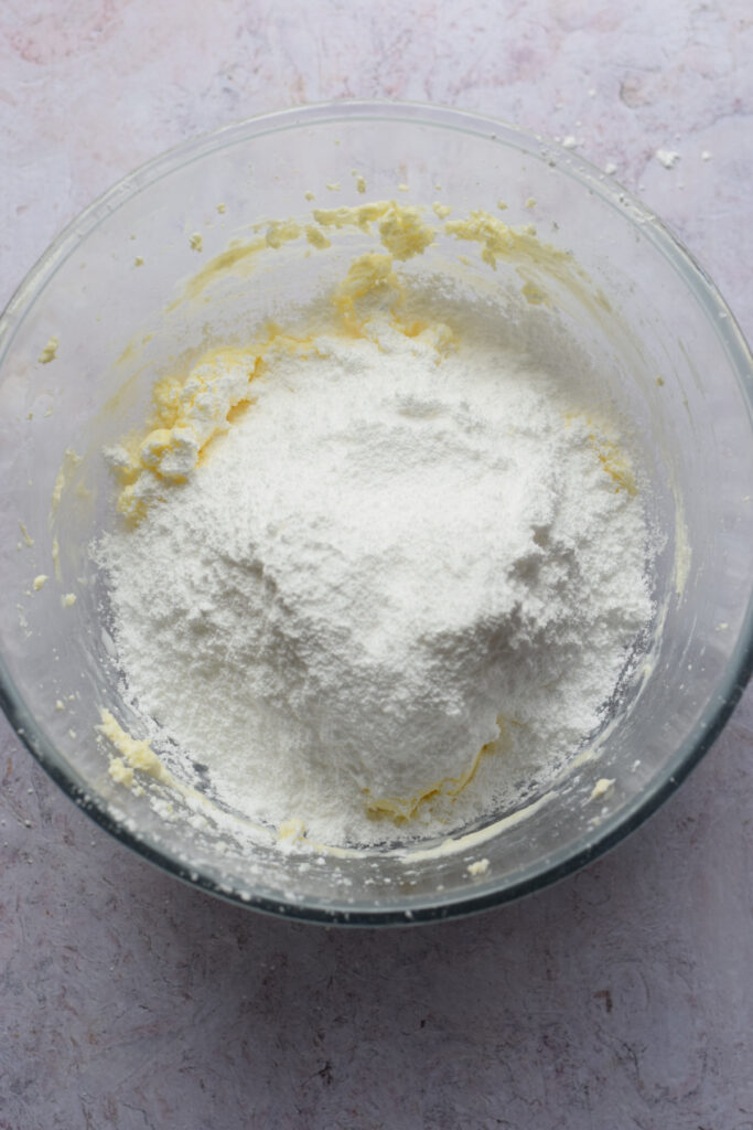 Making frosting in a bowl.