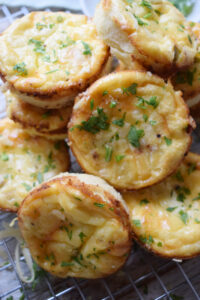 Bacon mini quiche in a stack.