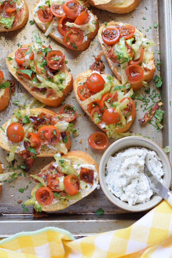 Bruschetta on a tray with a cream cheese spread.