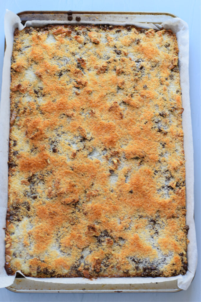 Baked cookie bars in a cookie sheet.