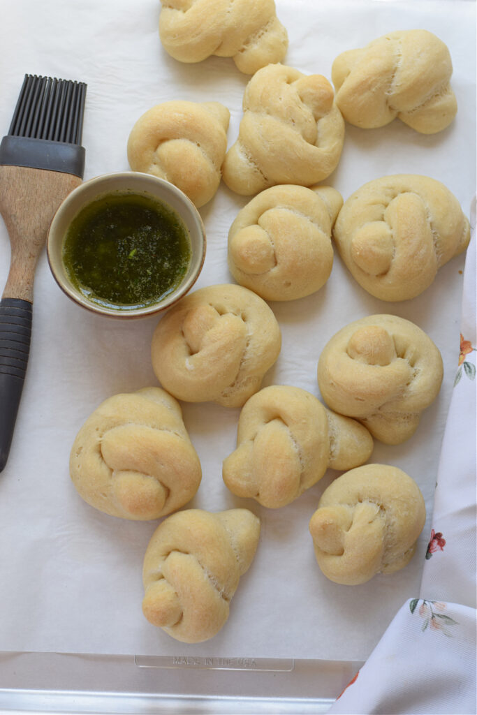 Baked garlic knots on a tray.