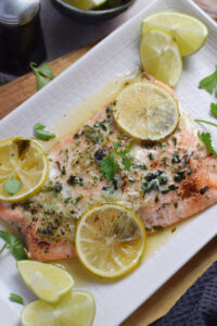 Honey lime salmon on a white plate.