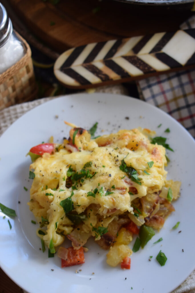 Close up of breakfast skillet on a plate.