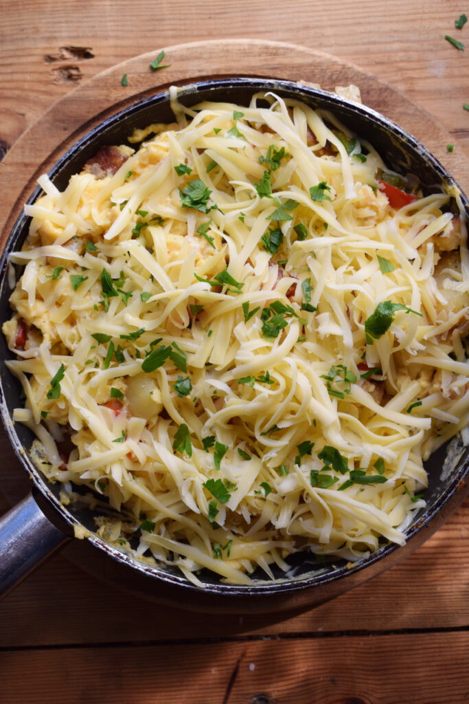 Breakfast egg skillet topped with cheese