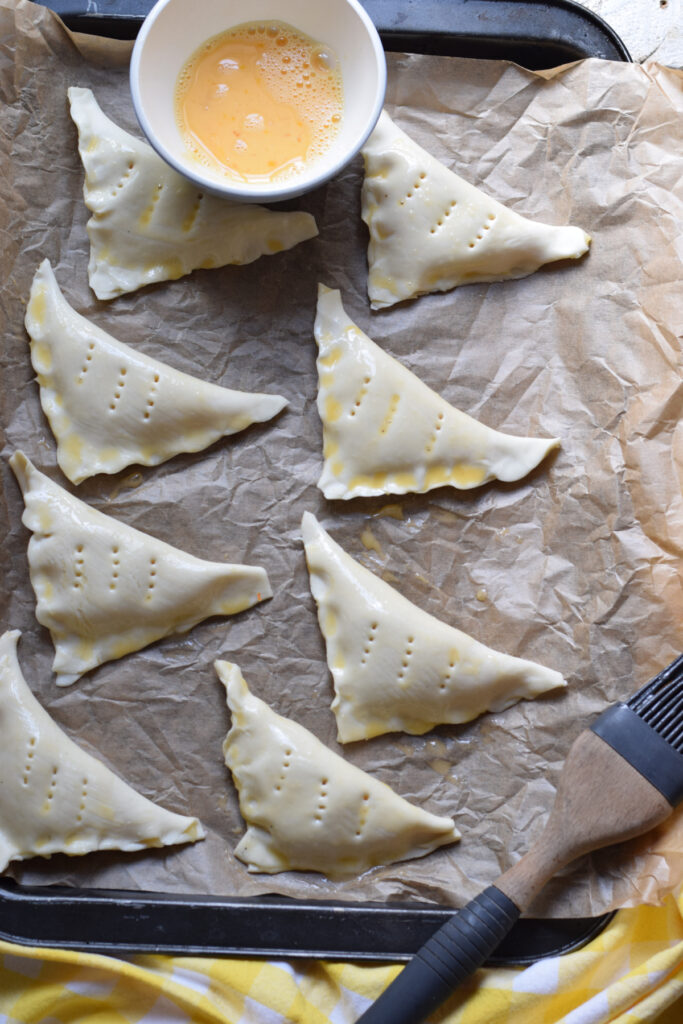 Ready to bake turnovers with a brushed egg wash.