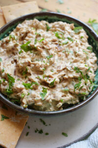 Close up of caramelized onion dip in a bowl.