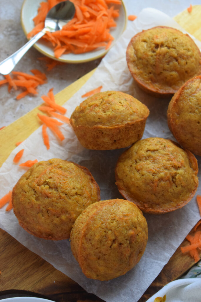 Carrot muffins on a serving plate.