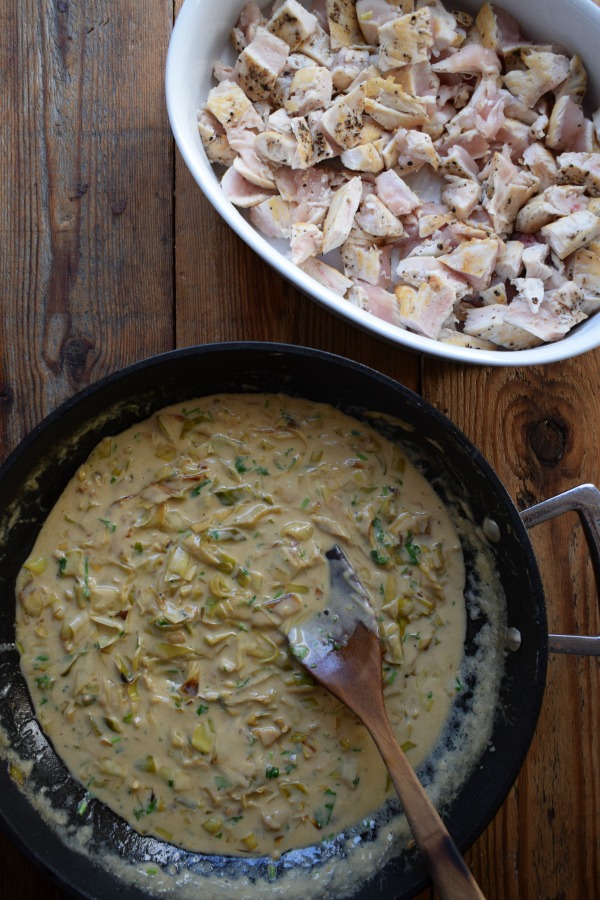 Ingredients on a wooden table to make a chicken pie.