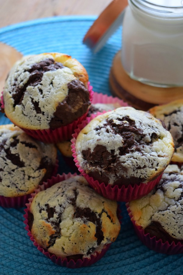 a stack of chocolate cream cheese muffins