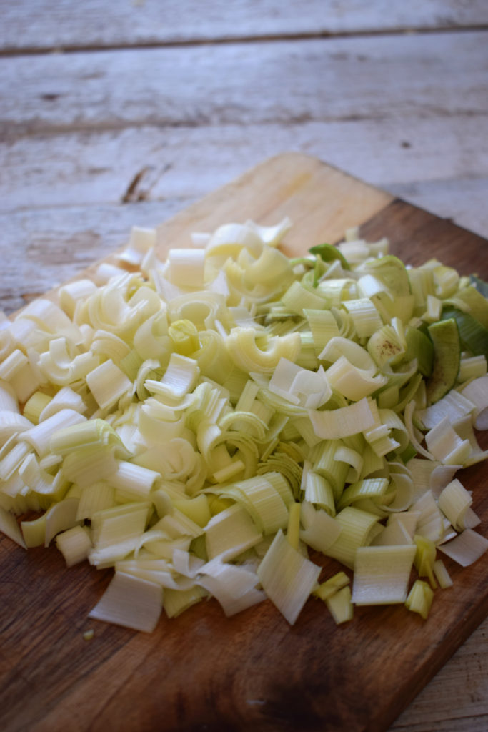 Chopped leeks on a cutting board.
