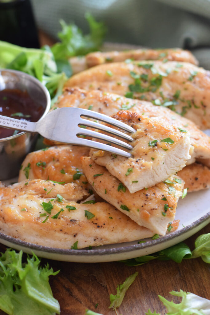 Close up of chicken tenders on a plate.