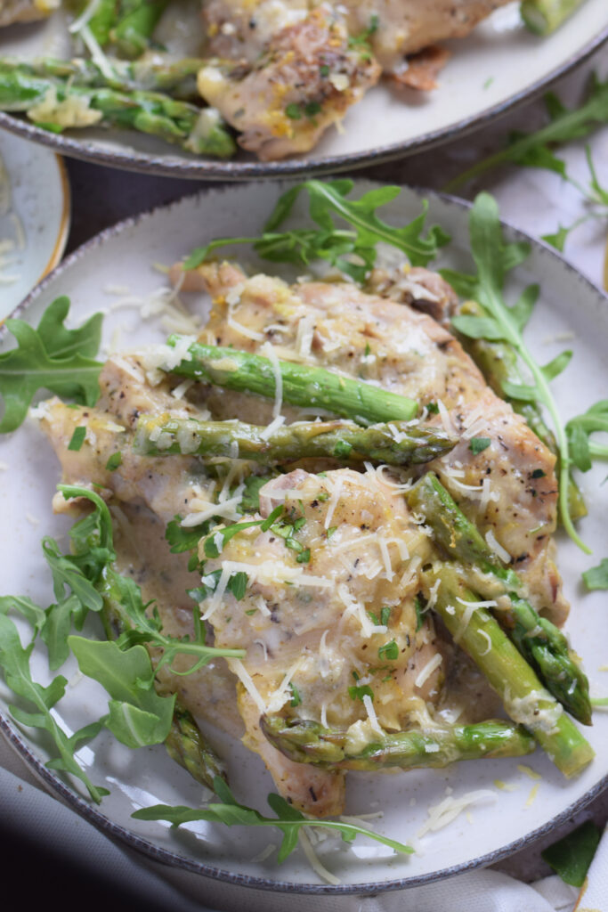 Close up of lemon chicken with asparagus.