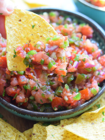 Close up of salsa on tortilla chips.