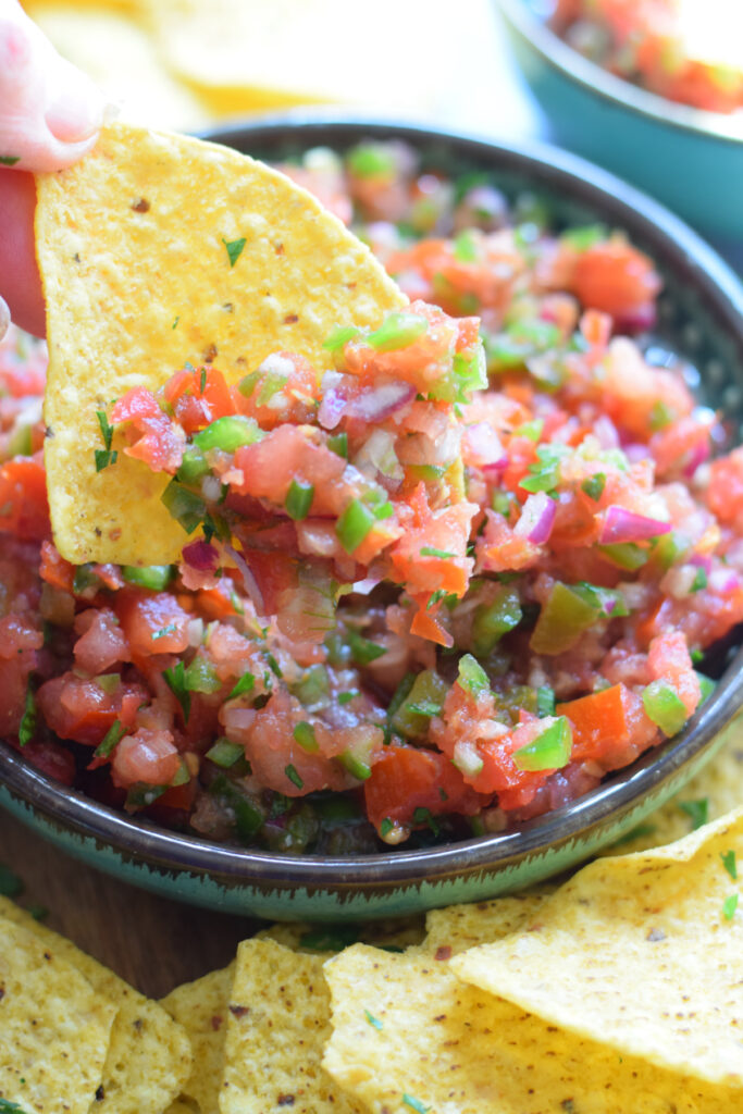 Close up of salsa on tortilla chips.