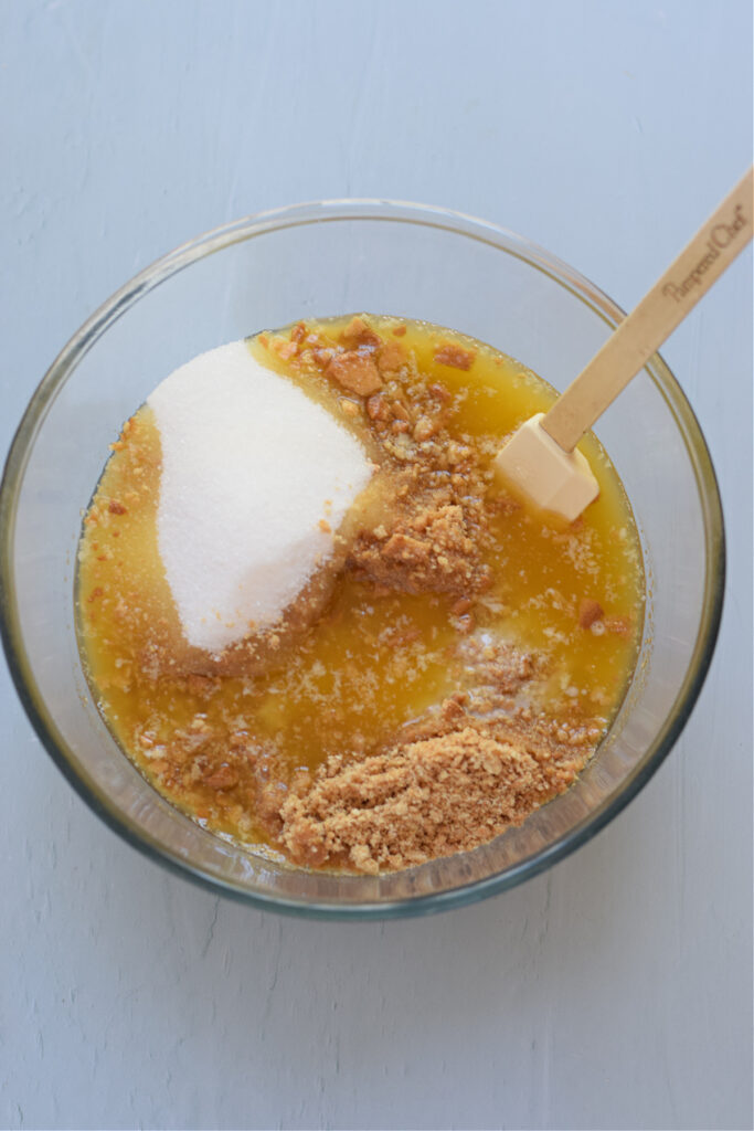Making a cookie base in a glass bowl.