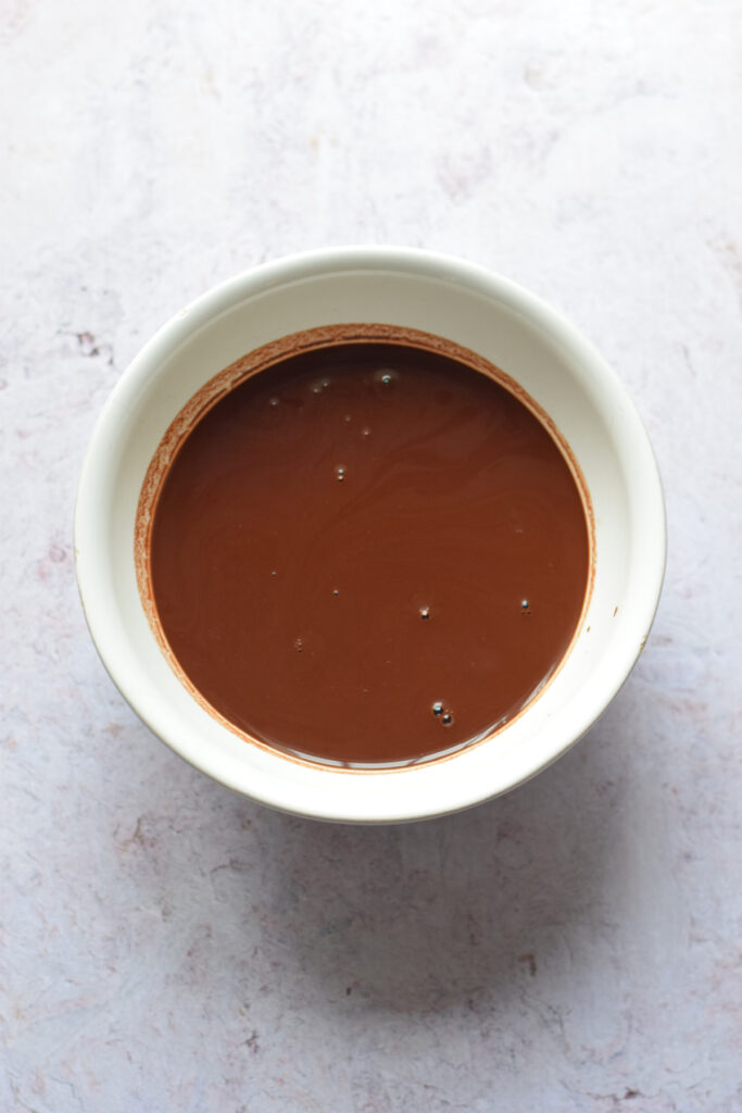 Chocolate mixture in a white bowl.