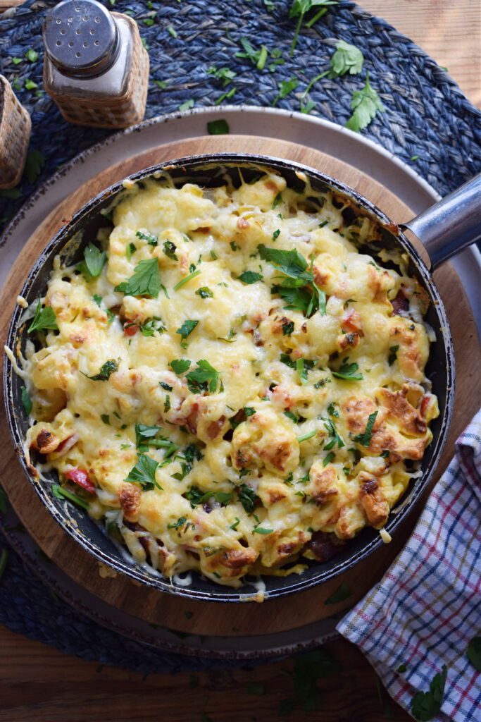 Egg and vegetable hash in a skillet.