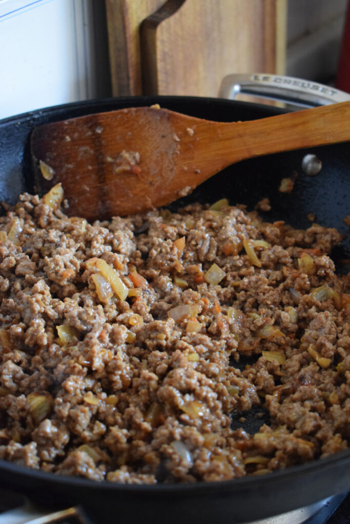 Cooking ground beef in a skillet.