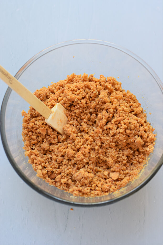 Cookie crumb mixture in a glass bowl.