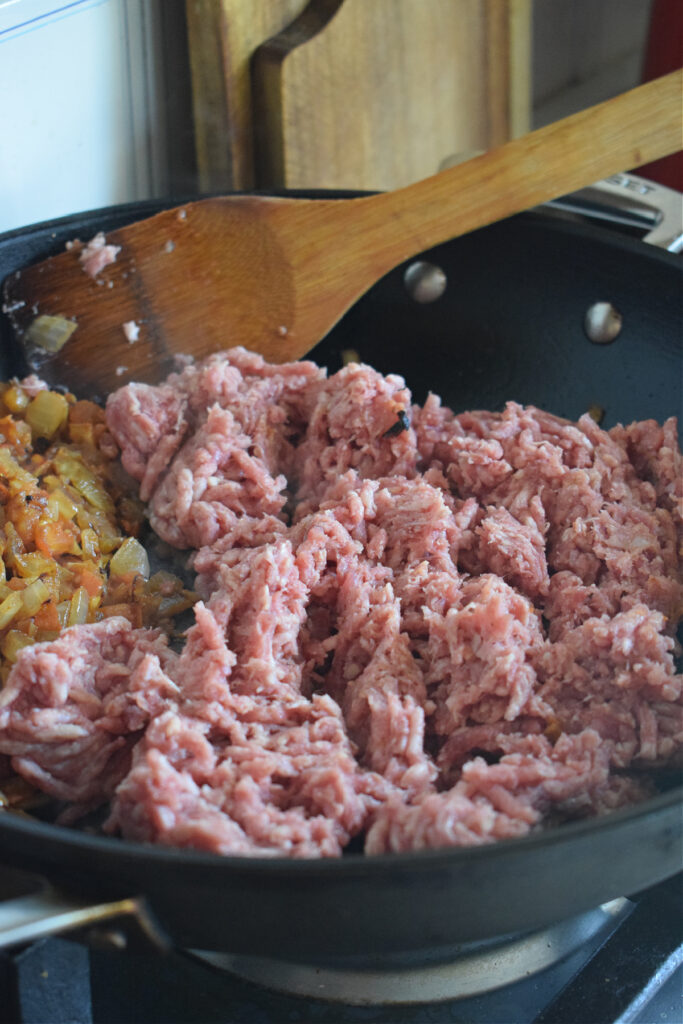 Ground beef in a skillet.