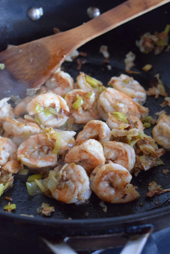 Cooking shrimp in a skillet.