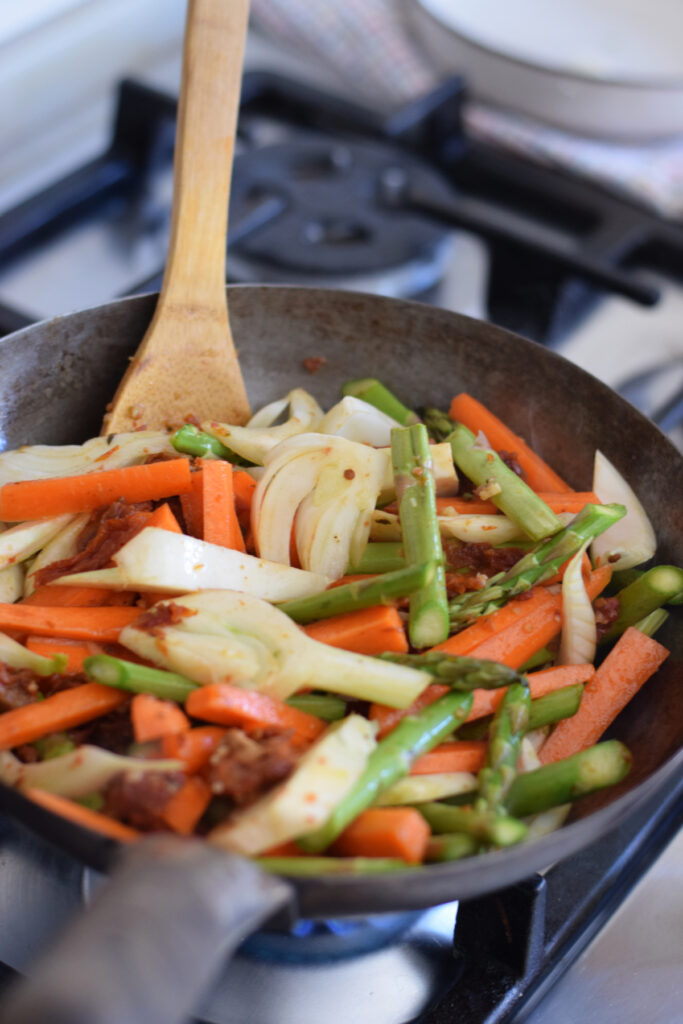 Cooking vegetables in a wok.