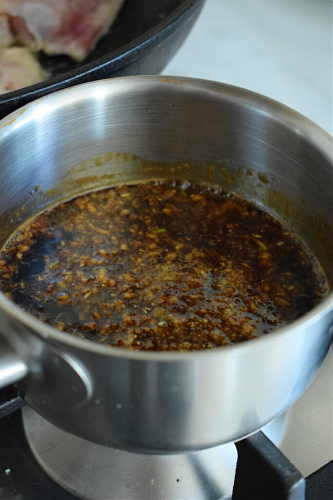 Making teriyaki sauce in a saucepan.