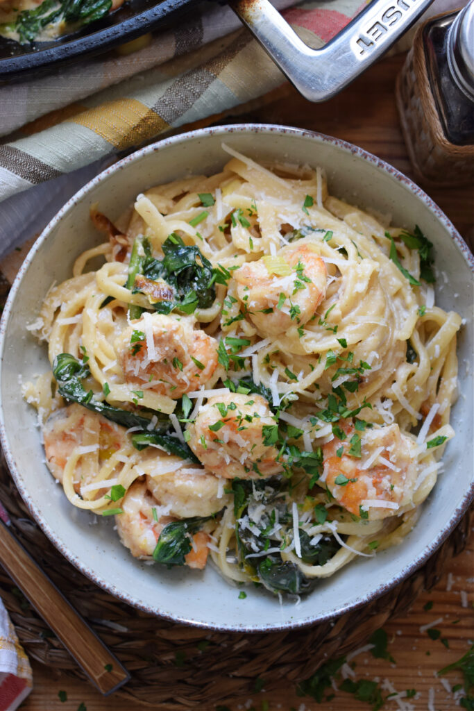 Creamy spaghetti with shrimp in a bowl.