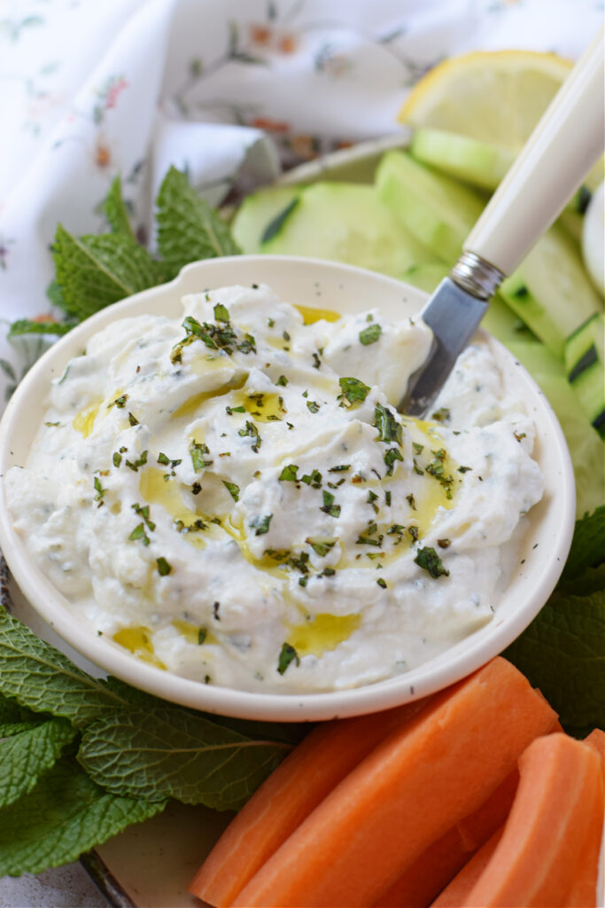 Close up of lemon ricotta dip with vegetables.