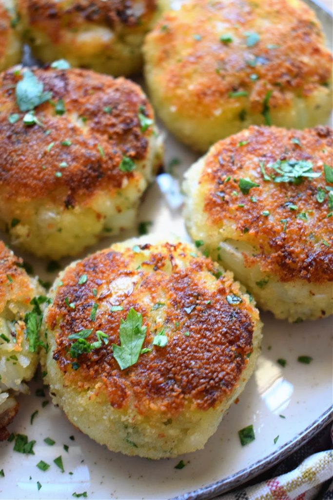 Crispy cod cakes on a plate.