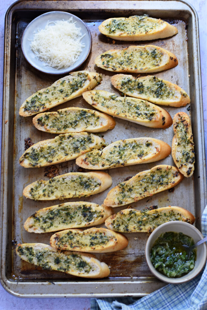 Garlic parmesan crostini on a tray.