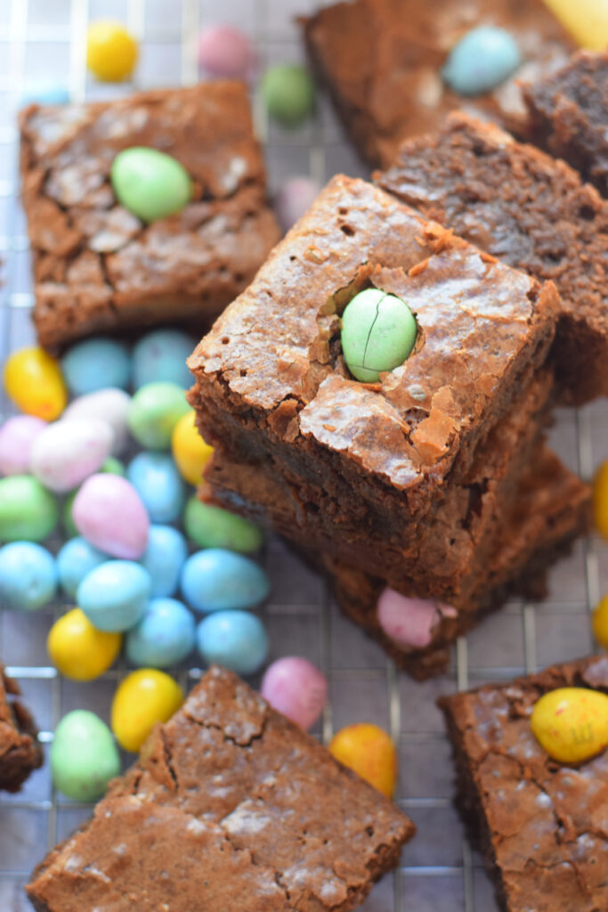Easter egg brownies on a cooling rack.