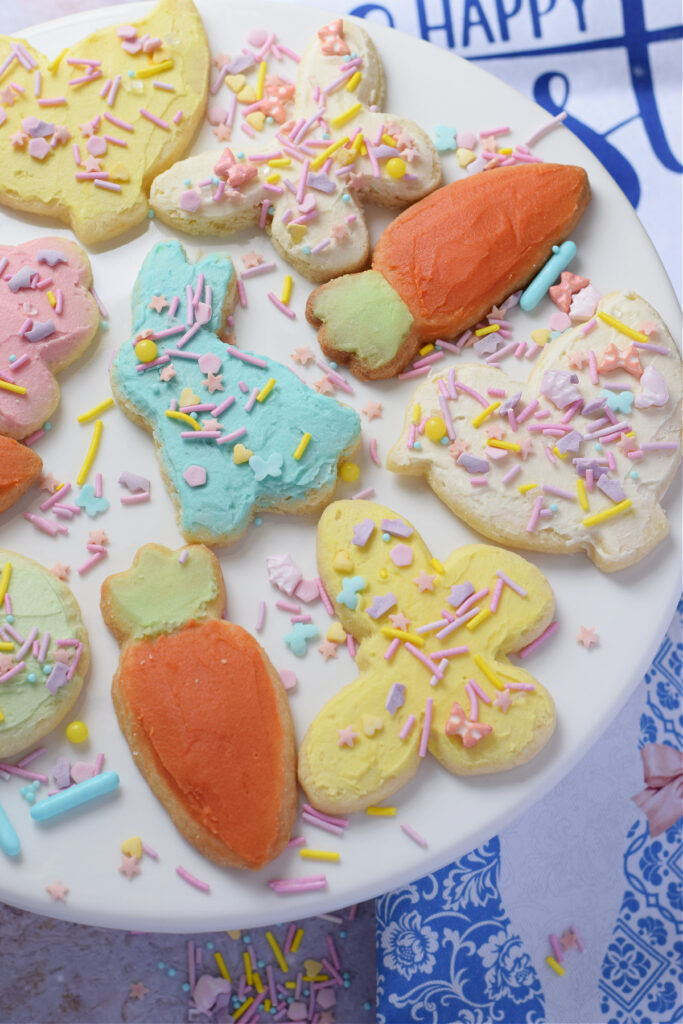 Easter sugar cookies on a white serving plate.