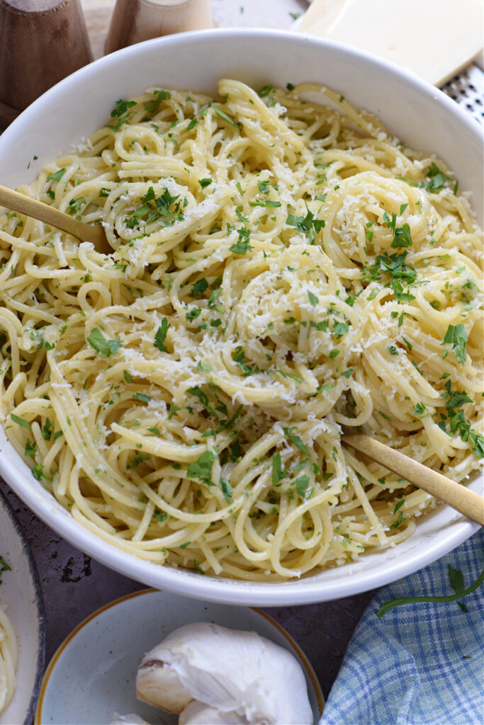 A bowl of garlic parmesan spaghetti.