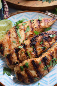 Chicken tenders on a plate.