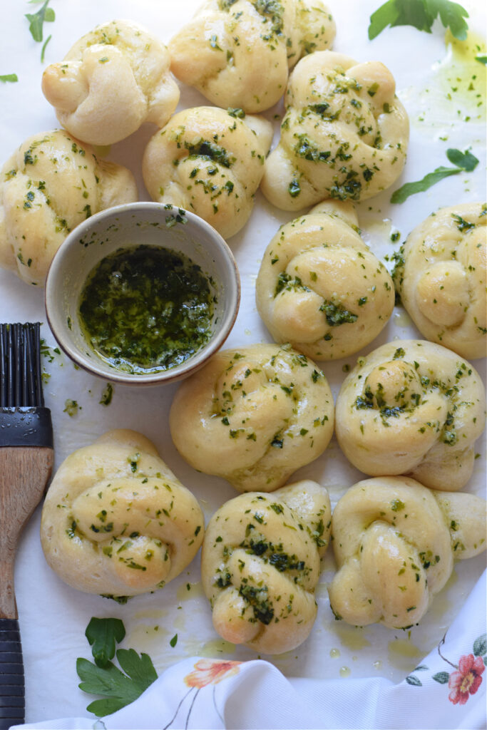Garlic knots brushed with garlic butter.