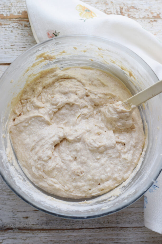 Making cake batter in a glass bowl.