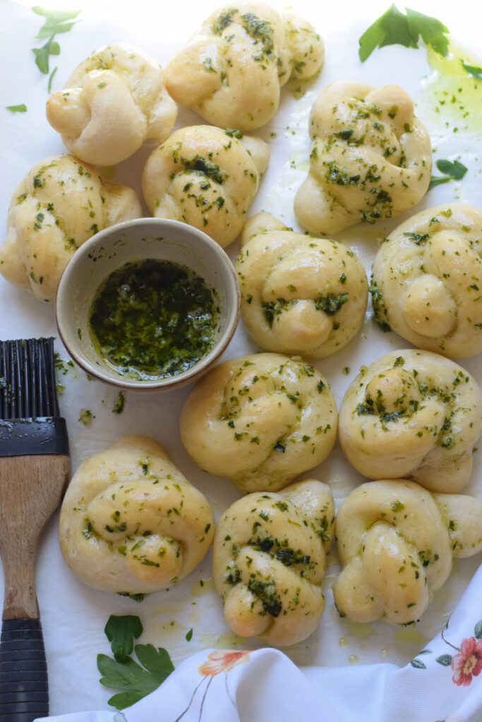 Homemade garlic knots on a tray.