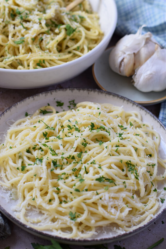 Close up of garlic parmesan spaghetti on a plate.