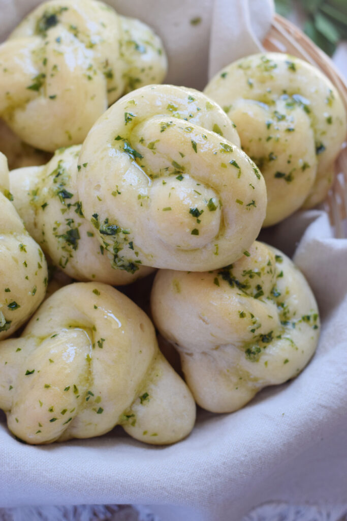 Close up of garlic knots in a basket.