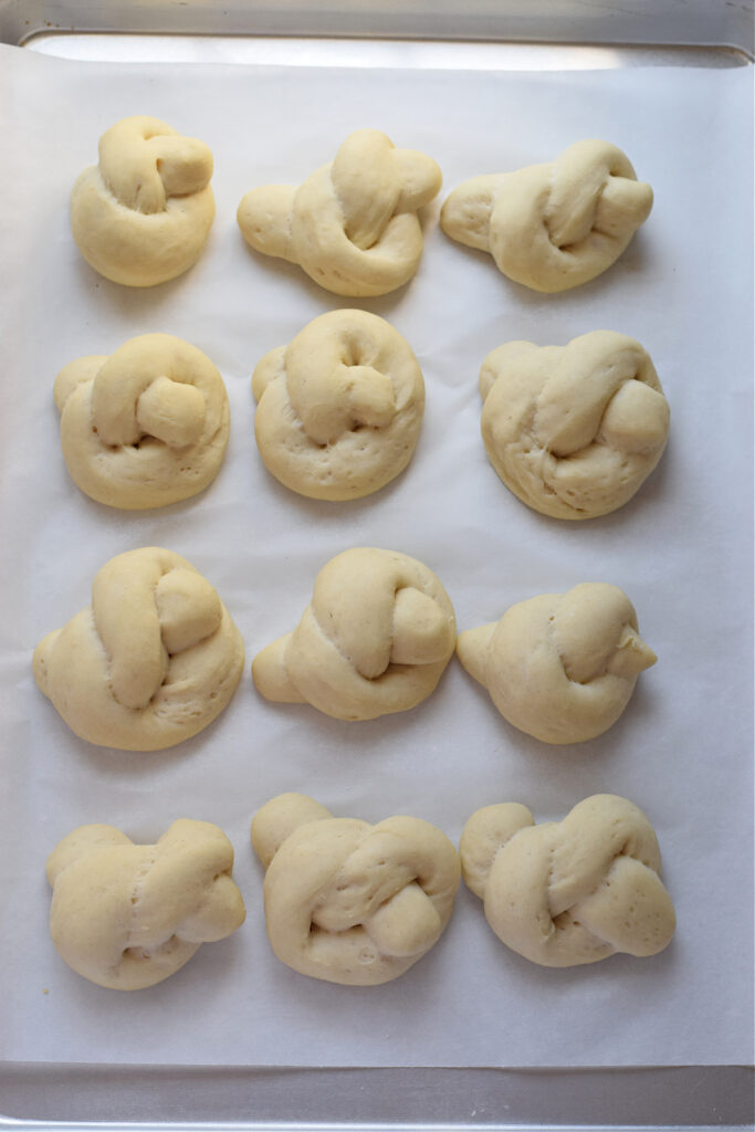 Garlic knots on a baking tray.