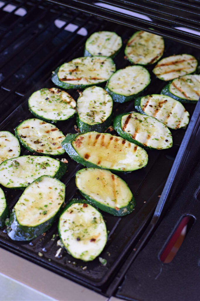 Cooking zucchini on a grill pan.