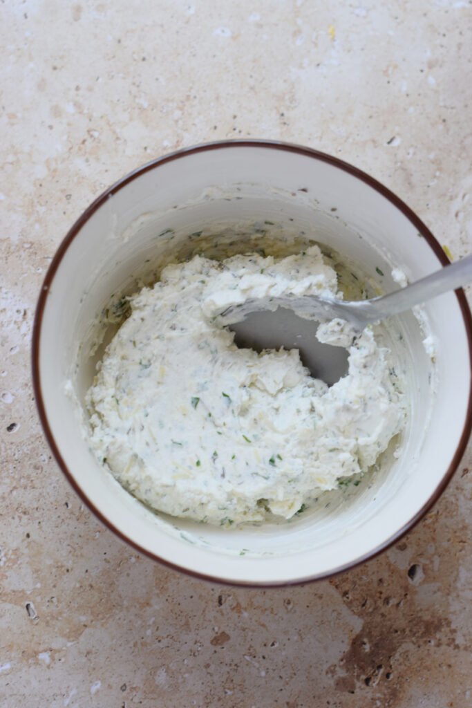 herb cream cheese in a bowl.