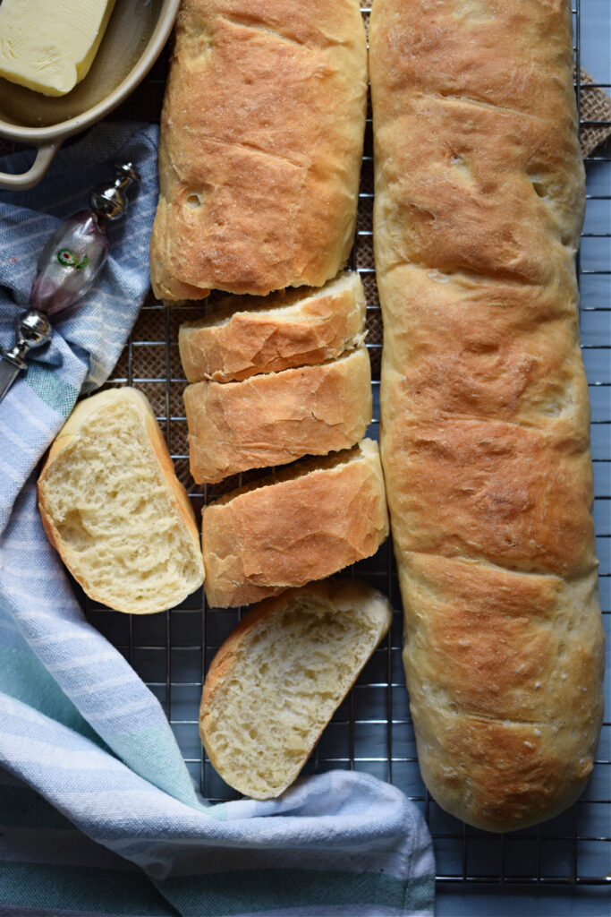 Fresh baked rustic bread on a tray.