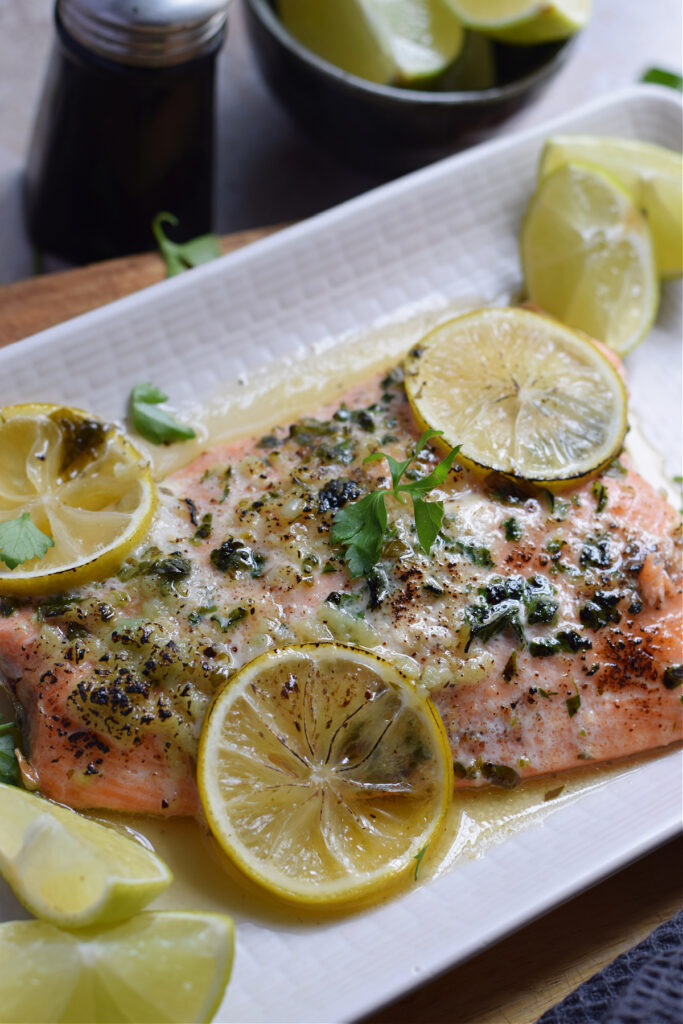 Close up of honey lime salmon on a white plate.
