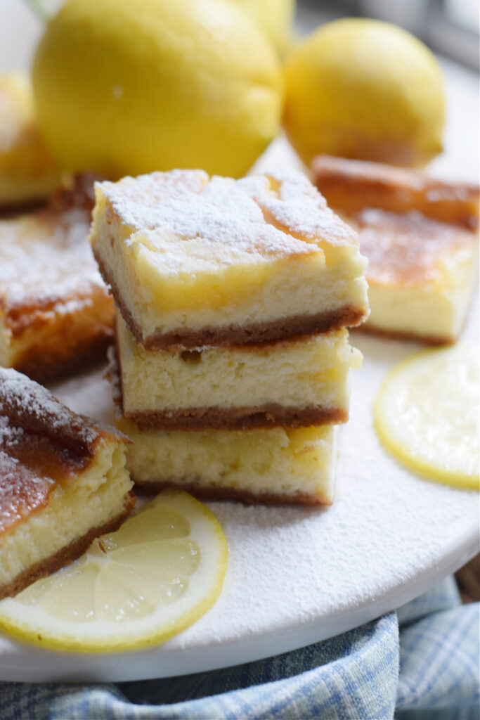 A stack of lemon cheesecake bars.